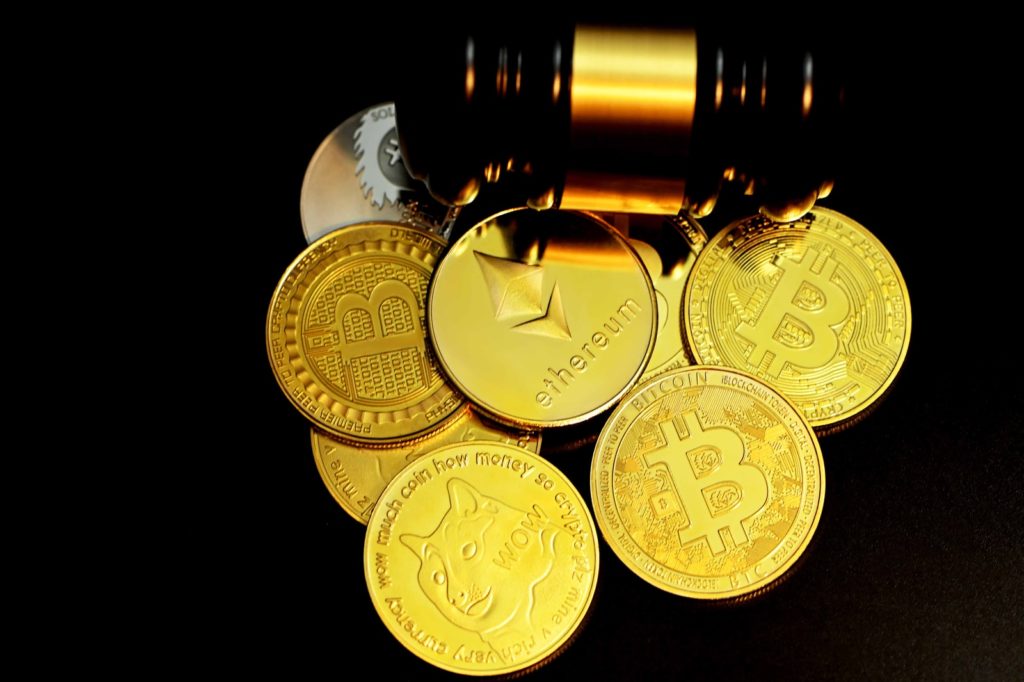 Bitcoin, Dogecoin or something else? gold round coins on white background