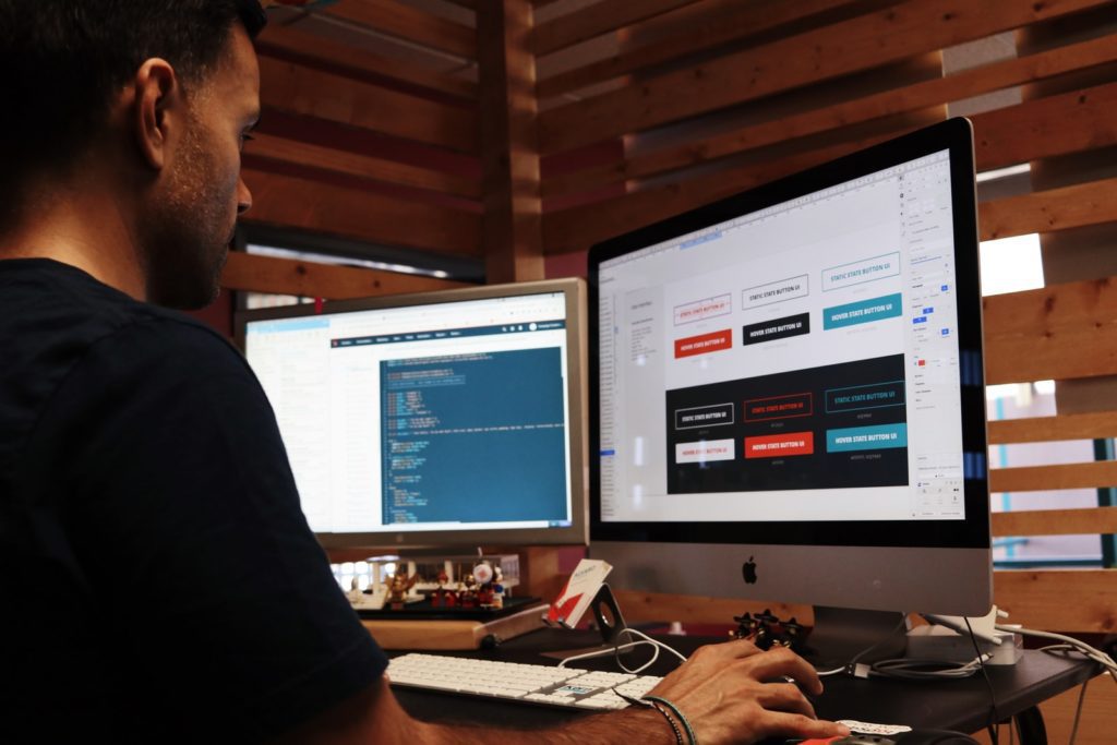 Best Web Development Service in the World man using Apple computer