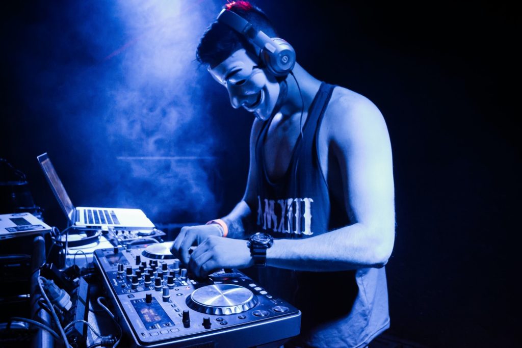 A Good Time For All man in black tank top playing dj mixer