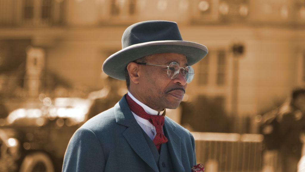 When Did Men Stop Wearing Hats? man wearing blue formal suit jacket
