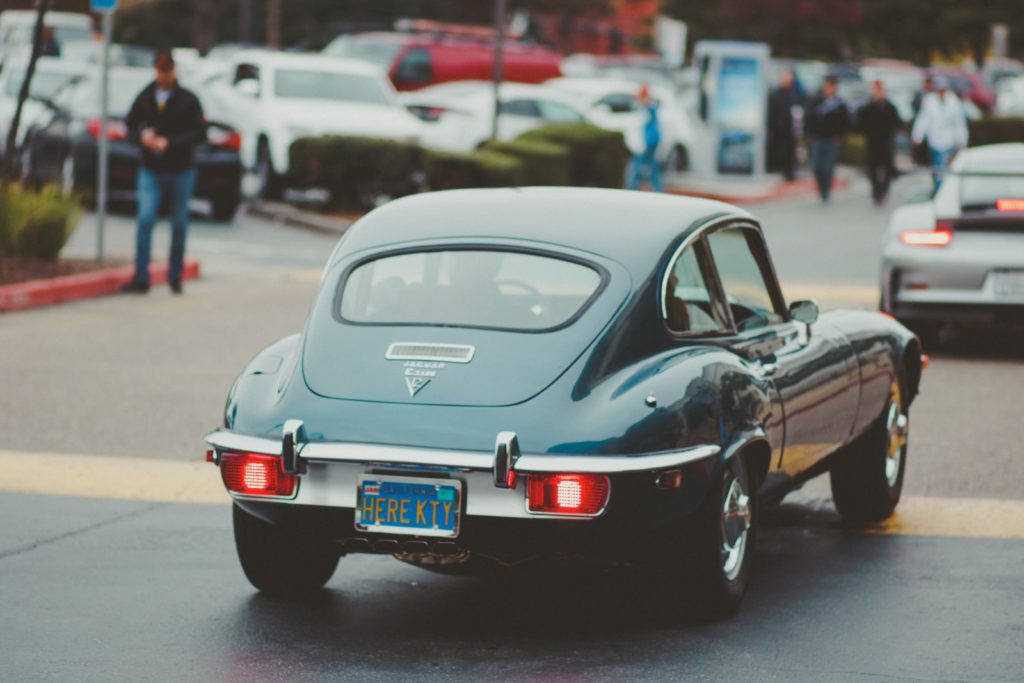 10 Coolest Celebrity Cars teal coupe passing by in street
