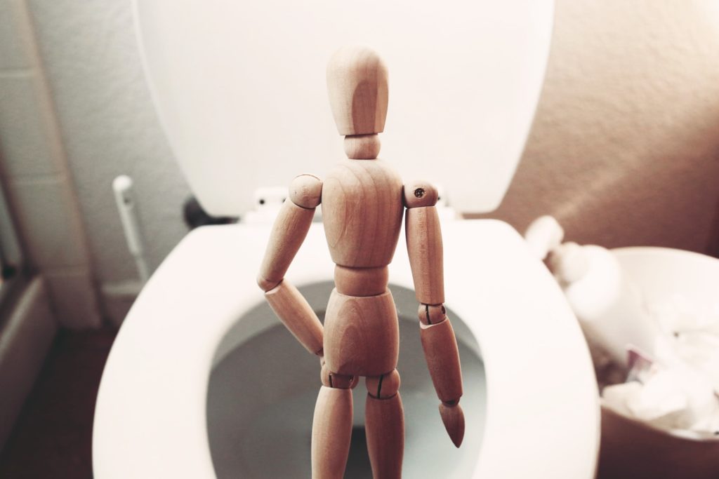 Safety Products Are Just A Click Away brown wooden mannequin on white ceramic toilet bowl
